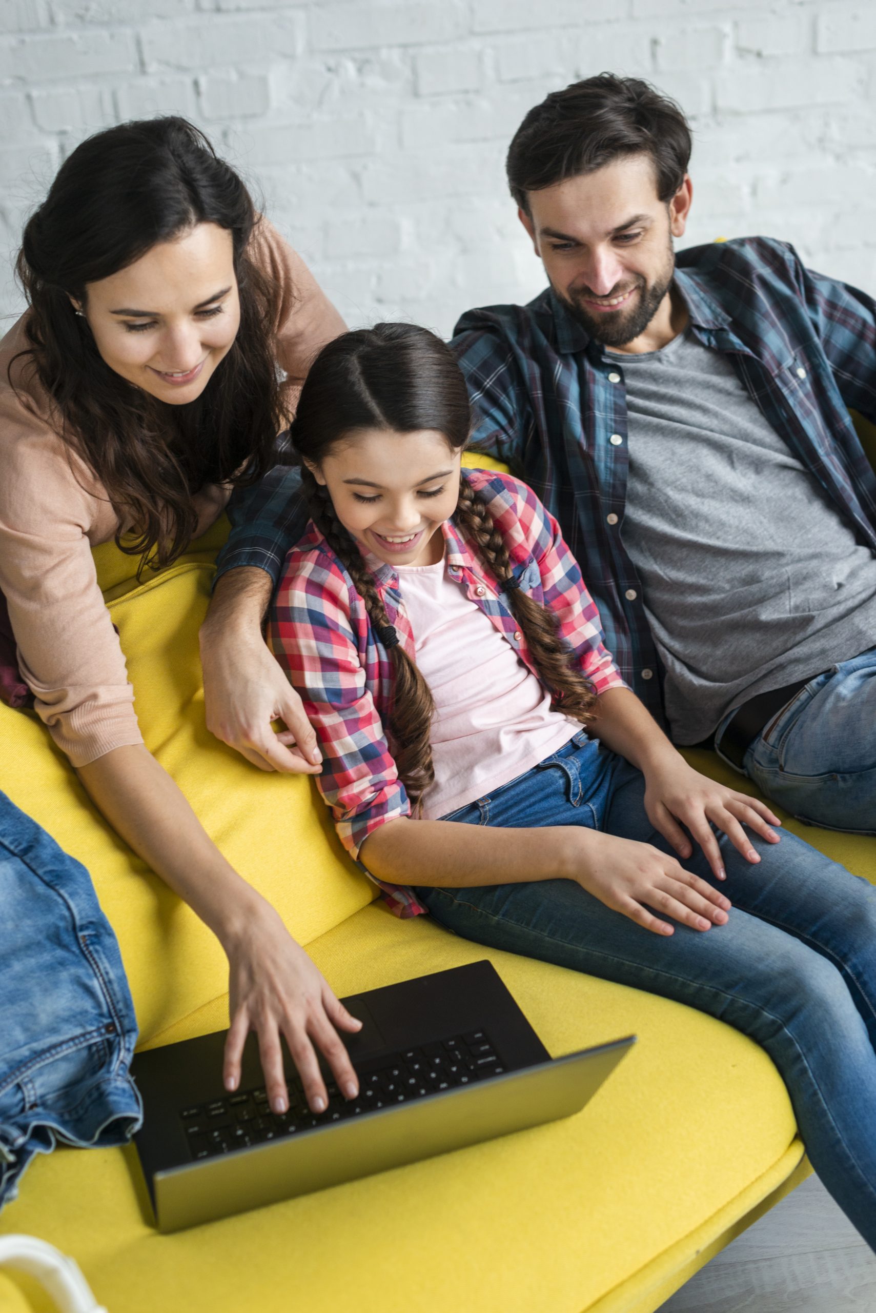 happy-family-using-laptop-high-view